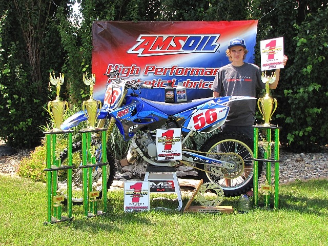 Kyle Biro with number one plates and trophies from WCAN MX.