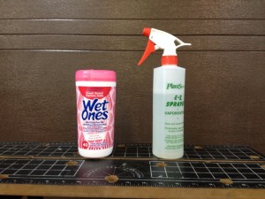 A Water Spray Bottle and Container of Wet Ones